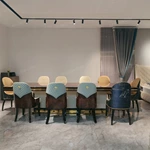 High-Gloss Amber Burl Wood Dining Table with Cream Quilted Leather Base and Metal Inlay